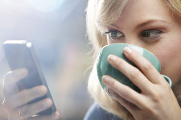 web design company-woman using phone